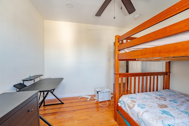 220 E 21st Ave, North Wildwood, NJ 08260 - bedroom with baseboards, light wood-style floors, an AC wall unit, and a ceiling fan