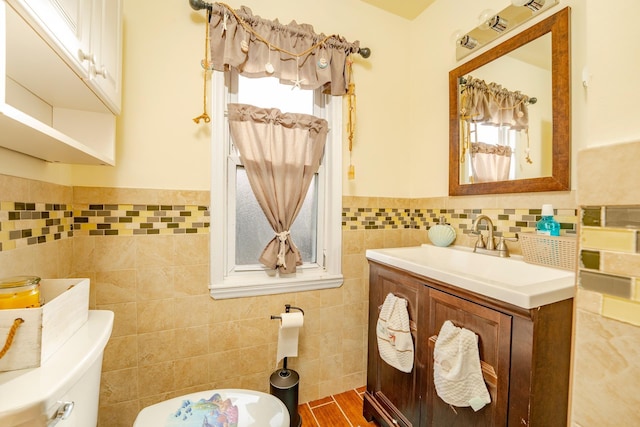 220 E 21st Ave, North Wildwood, NJ 08260 - bathroom featuring tile walls, a wainscoted wall, toilet, and vanity