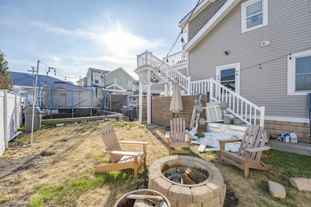 220 E 21st Ave, North Wildwood, NJ 08260 - view of yard with a trampoline, a fire pit, fence, and stairs