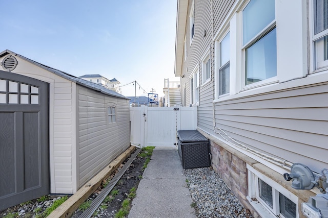 220 E 21st Ave, North Wildwood, NJ 08260 - view of side of property featuring an outbuilding, a gate, and fence