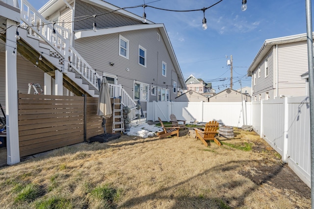 220 E 21st Ave, North Wildwood, NJ 08260 - back of house featuring a fenced backyard, stairs, and a yard