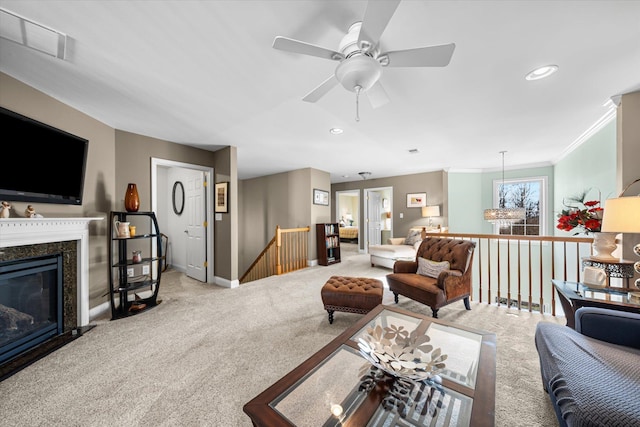 living room featuring ornamental molding, light colored carpet, and a premium fireplace