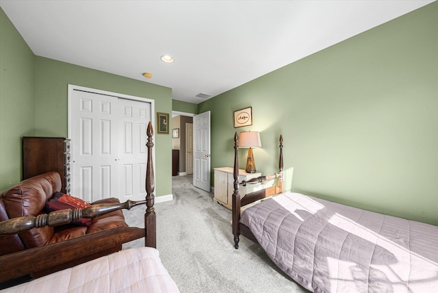 carpeted bedroom with a closet