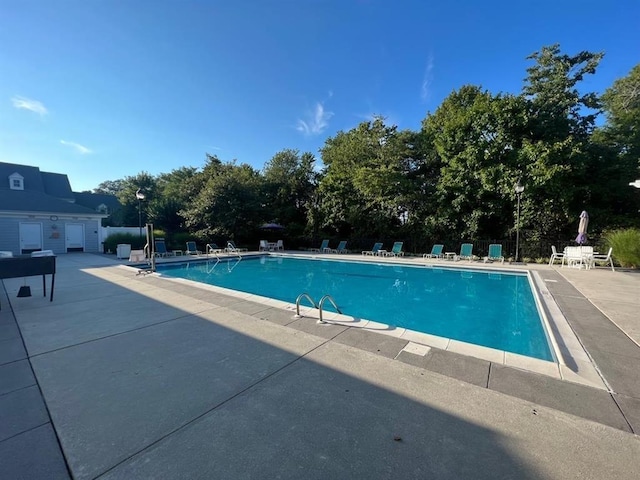 view of pool featuring a patio area