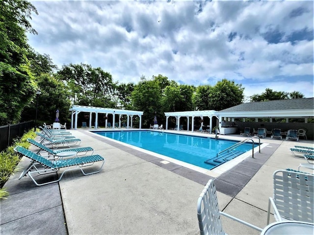 view of pool featuring a pergola and a patio