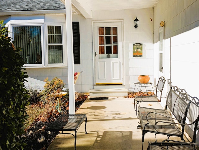 entrance to property featuring a patio