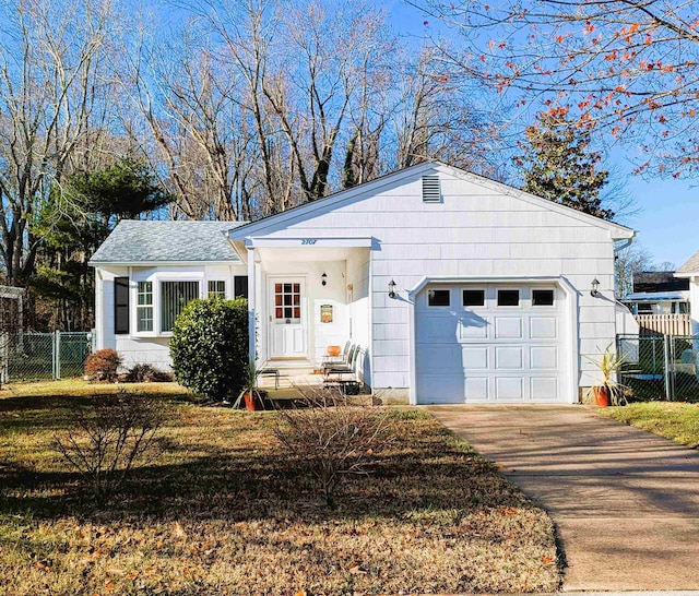 ranch-style house featuring a garage and a front lawn