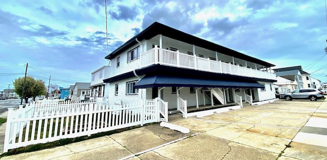 403 E 15th Ave Unit 4Corner, North Wildwood, NJ 08260 - view of front of property featuring a fenced front yard and covered porch