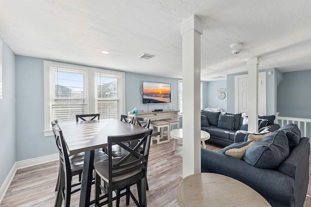 140 E Burk Ave Unit A, Wildwood, NJ 08260 - dining area with light wood finished floors and a textured ceiling