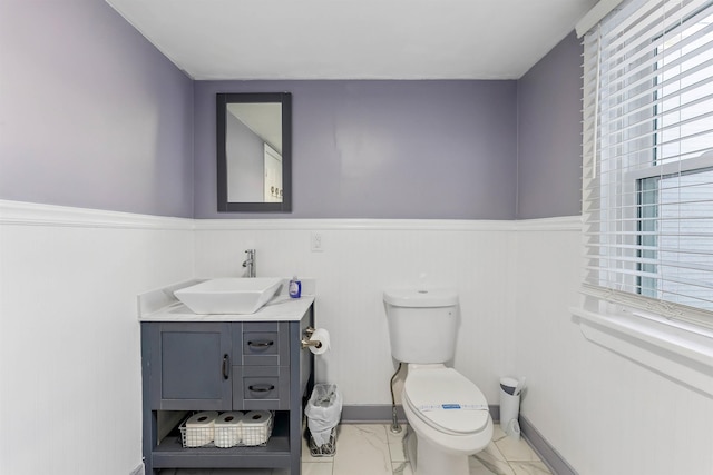 140 E Burk Ave Unit A, Wildwood, NJ 08260 - half bathroom featuring marble finish floors, vanity, a wainscoted wall, and healthy amount of natural light