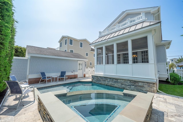 261 45th St, Avalon, NJ 08202 - swimming pool with a sunroom, an in-ground hot tub, and a patio area