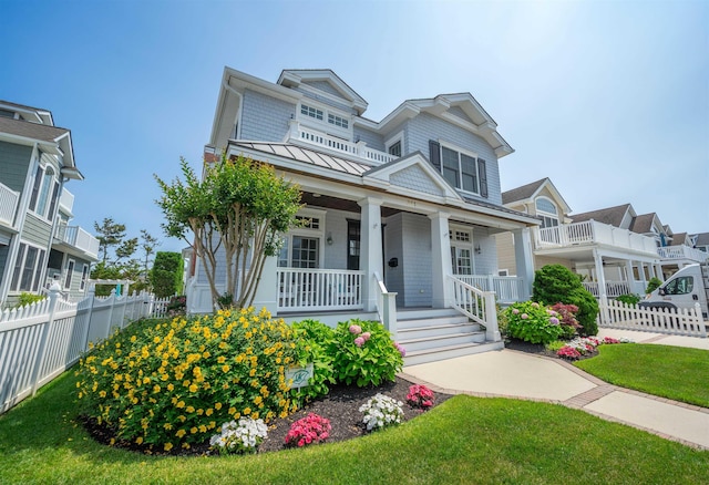 261 45th St, Avalon, NJ 08202 - view of front of house featuring a porch and a standing seam roof