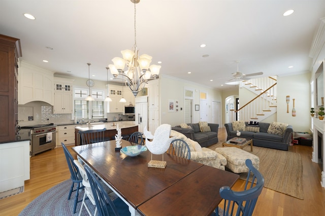 261 45th St, Avalon, NJ 08202 - dining space with stairway, light wood-style flooring, ornamental molding, ceiling fan, and recessed lighting