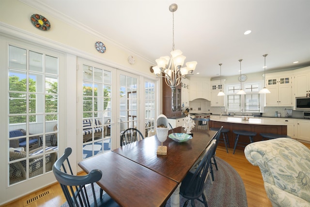 261 45th St, Avalon, NJ 08202 - dining room featuring a chandelier, light wood finished floors, crown molding, and recessed lighting