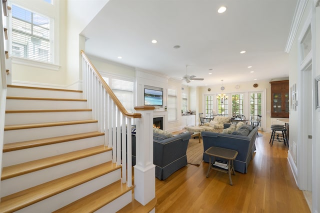 261 45th St, Avalon, NJ 08202 - living room with stairs, light wood-style floors, a ceiling fan, recessed lighting, and a fireplace