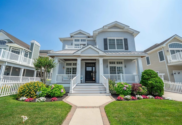 261 45th St, Avalon, NJ 08202 - view of front of property featuring a standing seam roof, covered porch, and a metal roof