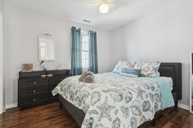 bedroom with ceiling fan and dark hardwood / wood-style flooring