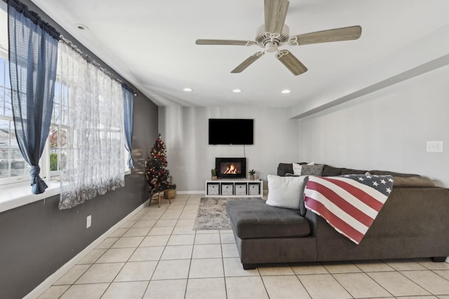 tiled living room featuring ceiling fan