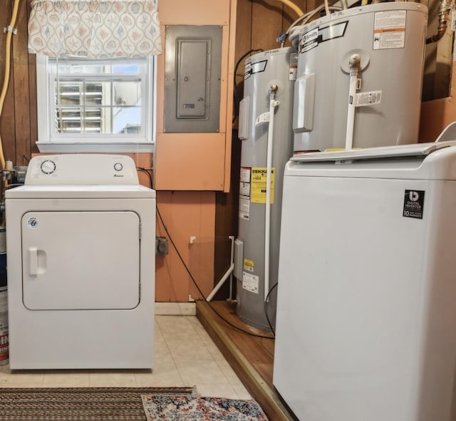 clothes washing area with washer / dryer, electric panel, light tile patterned floors, and water heater