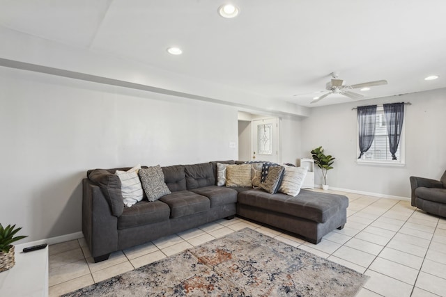 living room with ceiling fan and light tile patterned flooring