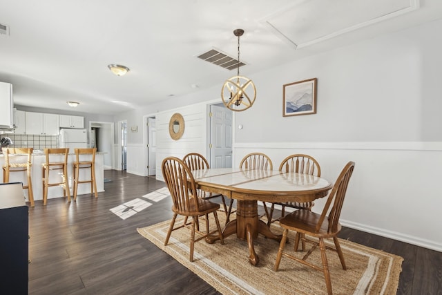 dining room featuring dark wood-type flooring