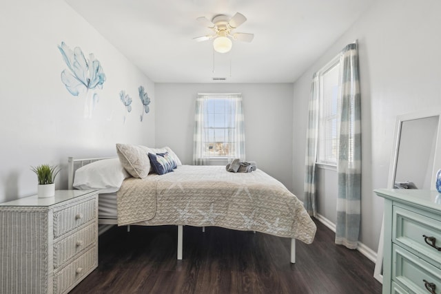 bedroom featuring dark hardwood / wood-style floors and ceiling fan