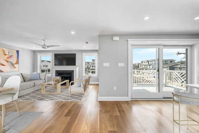 297 24th St Unit 297, Avalon, NJ 08202 - living area with healthy amount of natural light, wood finished floors, a fireplace, recessed lighting, and baseboards
