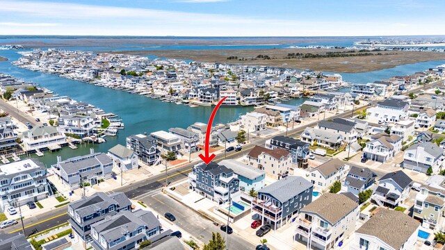 297 24th St Unit 297, Avalon, NJ 08202 - aerial perspective of suburban area featuring a large body of water