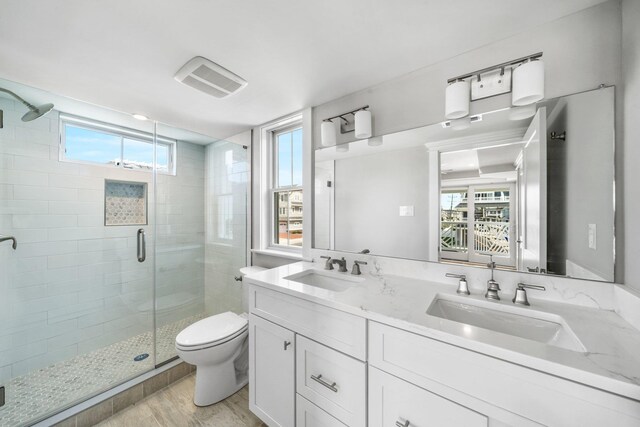 297 24th St Unit 297, Avalon, NJ 08202 - full bathroom with toilet, a shower stall, healthy amount of natural light, and double vanity