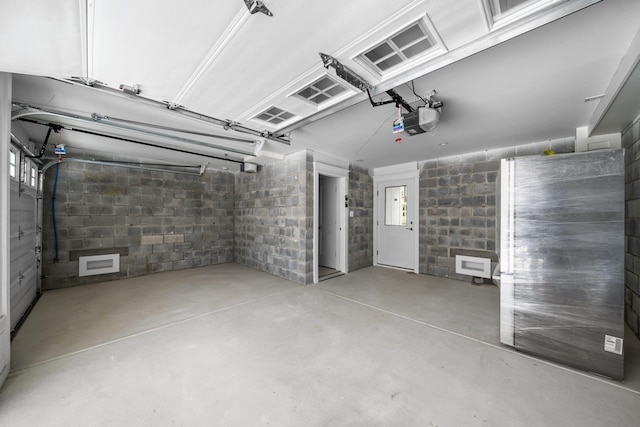 297 24th St Unit 297, Avalon, NJ 08202 - garage with a garage door opener and concrete block wall