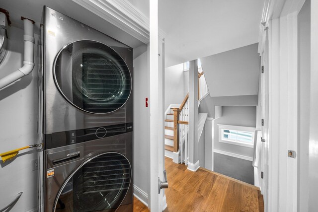 297 24th St Unit 297, Avalon, NJ 08202 - clothes washing area with stacked washer / dryer, wood finished floors, and baseboards
