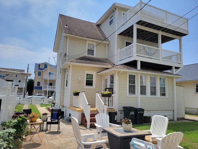 113 W Walnut Ave, North Wildwood, NJ 08260 - back of house featuring a patio area, a balcony, and roof with shingles