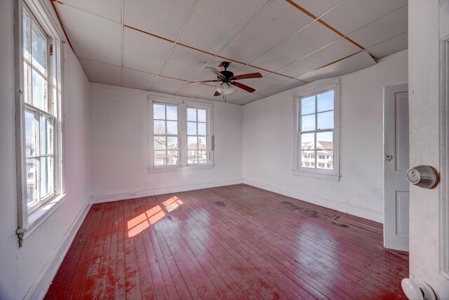 918 Stockton Ave, Cape May, NJ 08204 - empty room with a healthy amount of sunlight, wood-type flooring, baseboards, and a ceiling fan