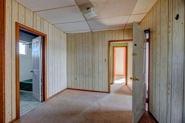 918 Stockton Ave, Cape May, NJ 08204 - carpeted empty room featuring wood walls, baseboards, and a drop ceiling