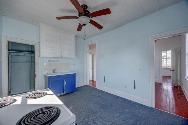 918 Stockton Ave, Cape May, NJ 08204 - kitchen featuring ceiling fan, blue cabinets, white electric range, baseboards, and light countertops