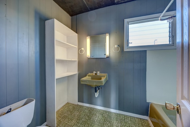 918 Stockton Ave, Cape May, NJ 08204 - bathroom with a bath, a sink, toilet, and baseboards