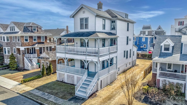 918 Stockton Ave, Cape May, NJ 08204 - view of front of house with covered porch, a front lawn, and a chimney