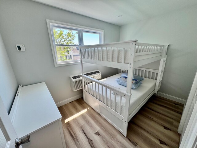 2001 Surf Ave Unit 12, North Wildwood, NJ 08260 - bedroom featuring baseboards and wood finished floors