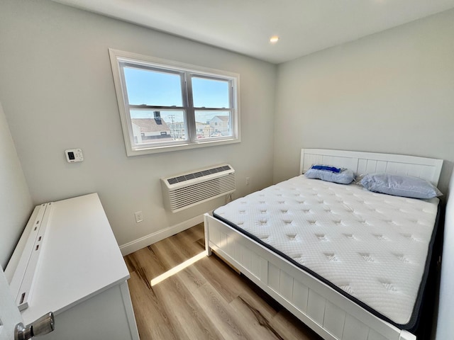 2001 Surf Ave Unit 12, North Wildwood, NJ 08260 - bedroom featuring a wall mounted AC, light wood-style flooring, and recessed lighting