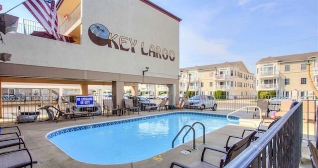 view of pool featuring a patio