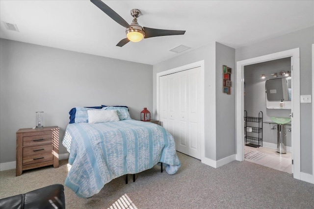 bedroom featuring light carpet, a closet, visible vents, and baseboards