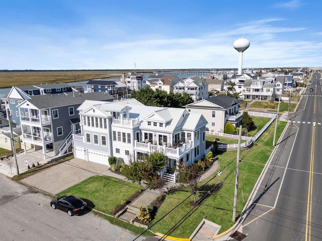 birds eye view of property with a residential view