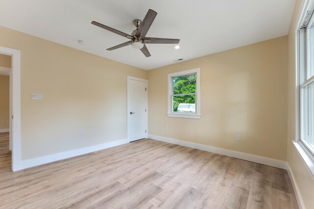 unfurnished room with light hardwood / wood-style flooring and ceiling fan