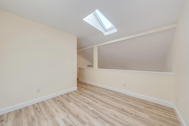 24 Heron Way N, Cape May, NJ 08204 - bonus room featuring a skylight, lofted ceiling, wood finished floors, and baseboards