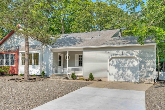 24 Heron Way N, Cape May, NJ 08204 - ranch-style house featuring a porch, an attached garage, and driveway