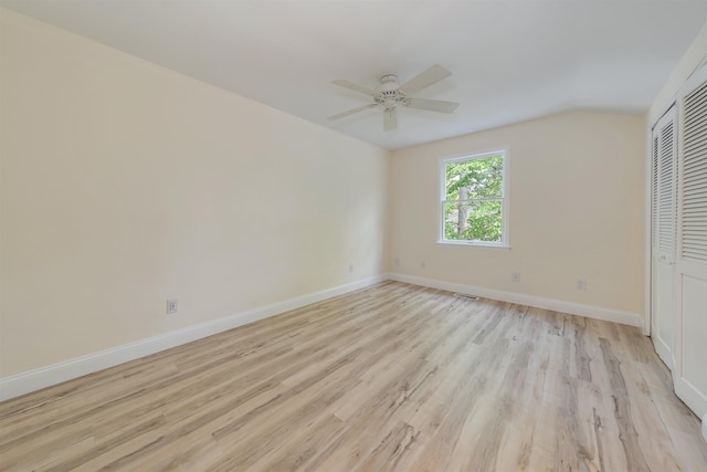 24 Heron Way N, Cape May, NJ 08204 - unfurnished bedroom with light wood finished floors, a closet, baseboards, a ceiling fan, and lofted ceiling