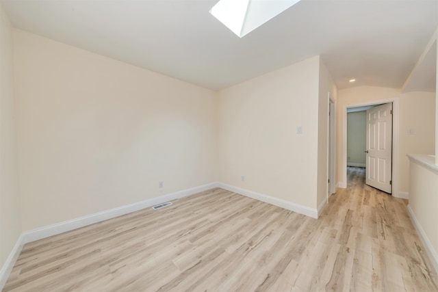 24 Heron Way N, Cape May, NJ 08204 - spare room featuring a skylight, light wood-type flooring, baseboards, and recessed lighting