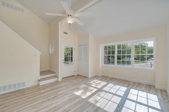 24 Heron Way N, Cape May, NJ 08204 - unfurnished room with plenty of natural light, high vaulted ceiling, light wood finished floors, stairs, and baseboards