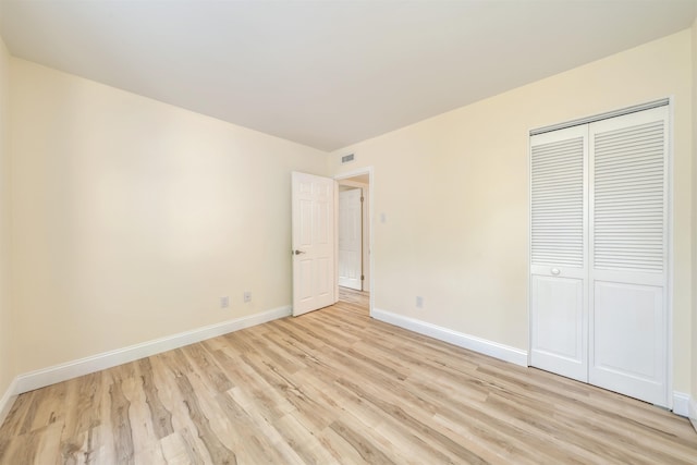 24 Heron Way N, Cape May, NJ 08204 - unfurnished bedroom featuring light wood finished floors, baseboards, and a closet