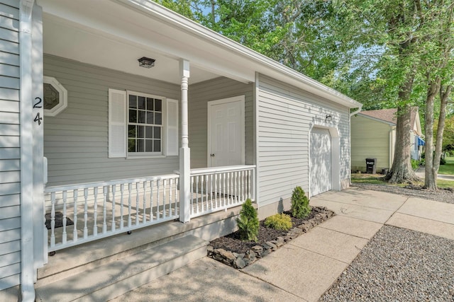 24 Heron Way N, Cape May, NJ 08204 - doorway to property featuring covered porch and an attached garage